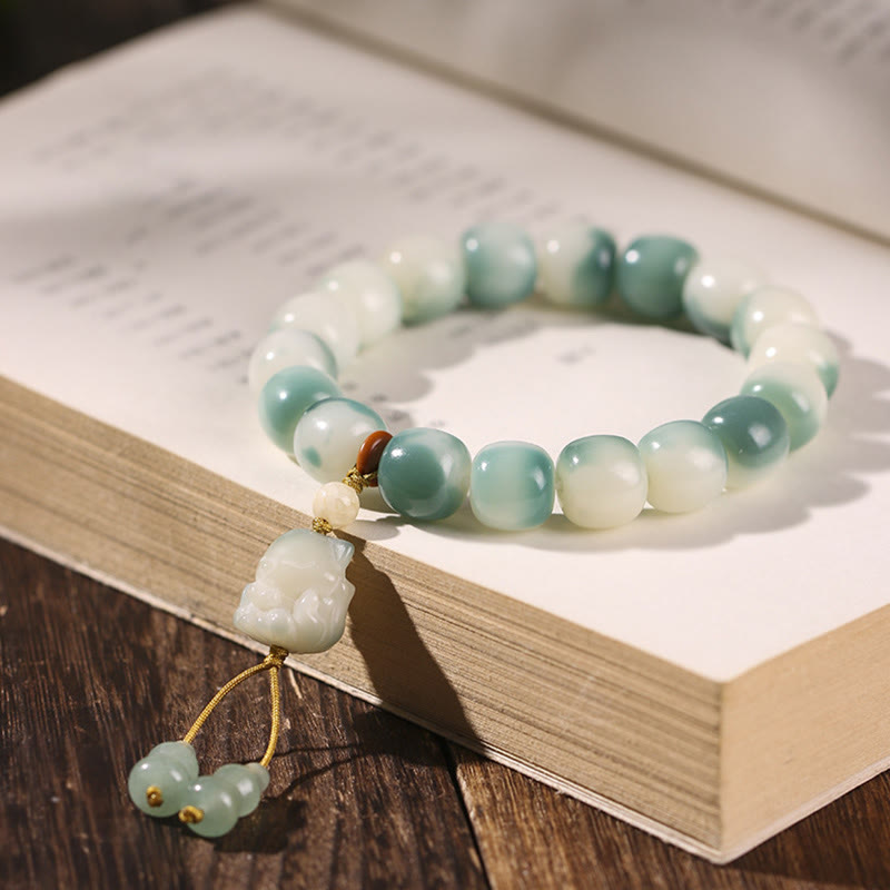 KarmaRipple's Gradient Bodhi Seed Nine Tailed Fox Cat Paw Claw Pine Cone Peace Bracelet p1