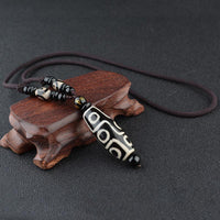 KarmaRipple's Nine-Eye Dzi Bead Wealth Protection Pendant